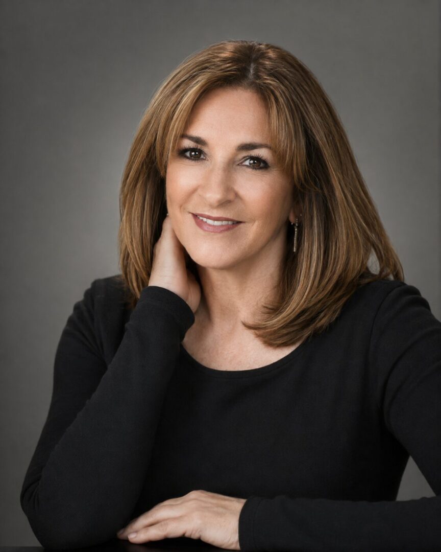Smiling woman with shoulder-length brown hair